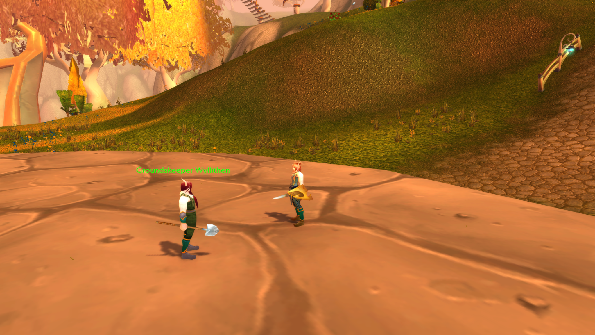 A blood elf with a golden shield faces Groundskeeper Wyllithen, who carries a spade, on an open stone terrace.