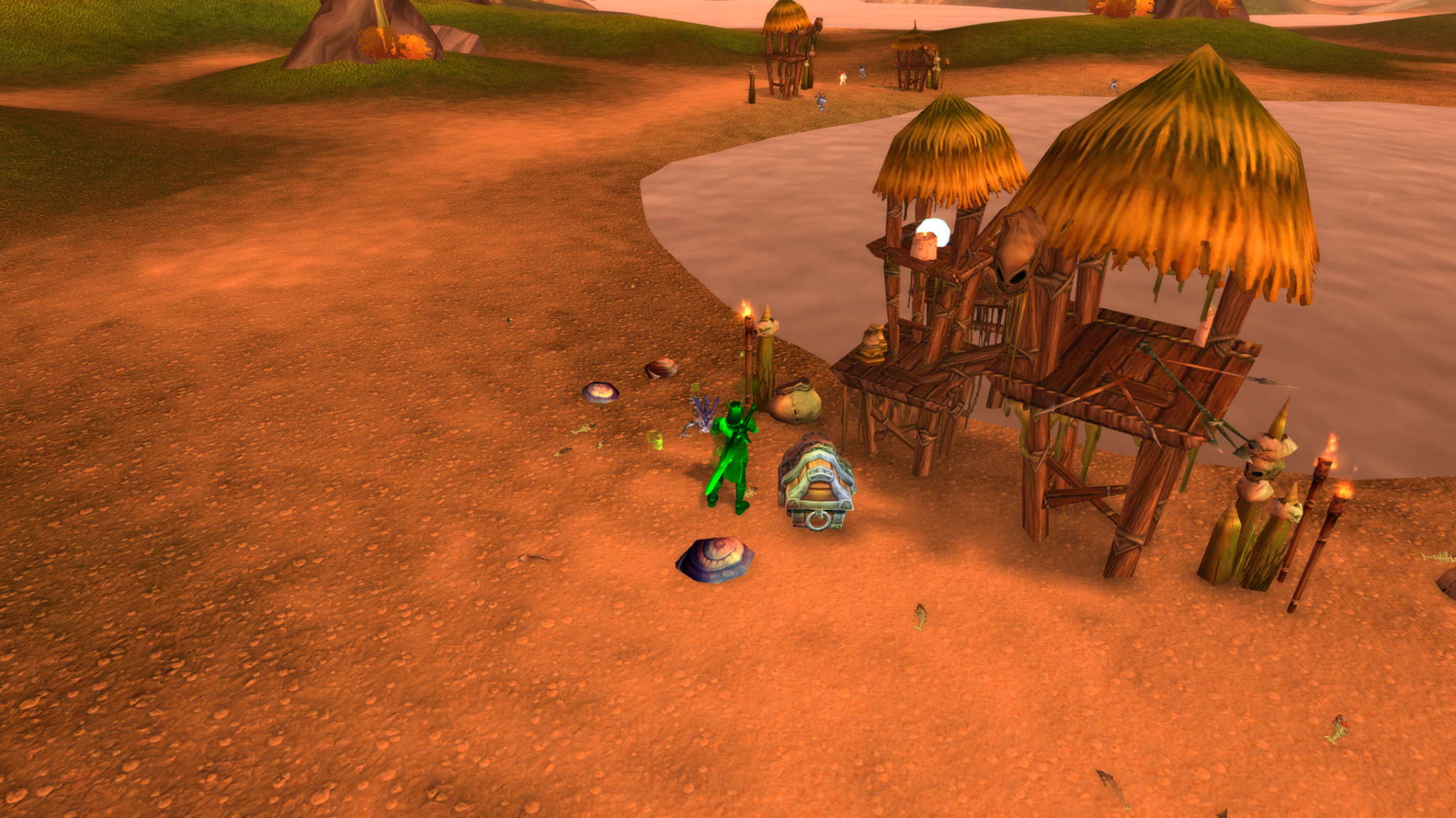 A character beside a treasure chest among thatched huts in a coastal murloc camp.